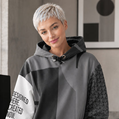 USA CREATES 250 Icon Hoodie Neutral, tonal gray color-block hoodie worn by a woman with short silver hair in an interior editorial portrait
