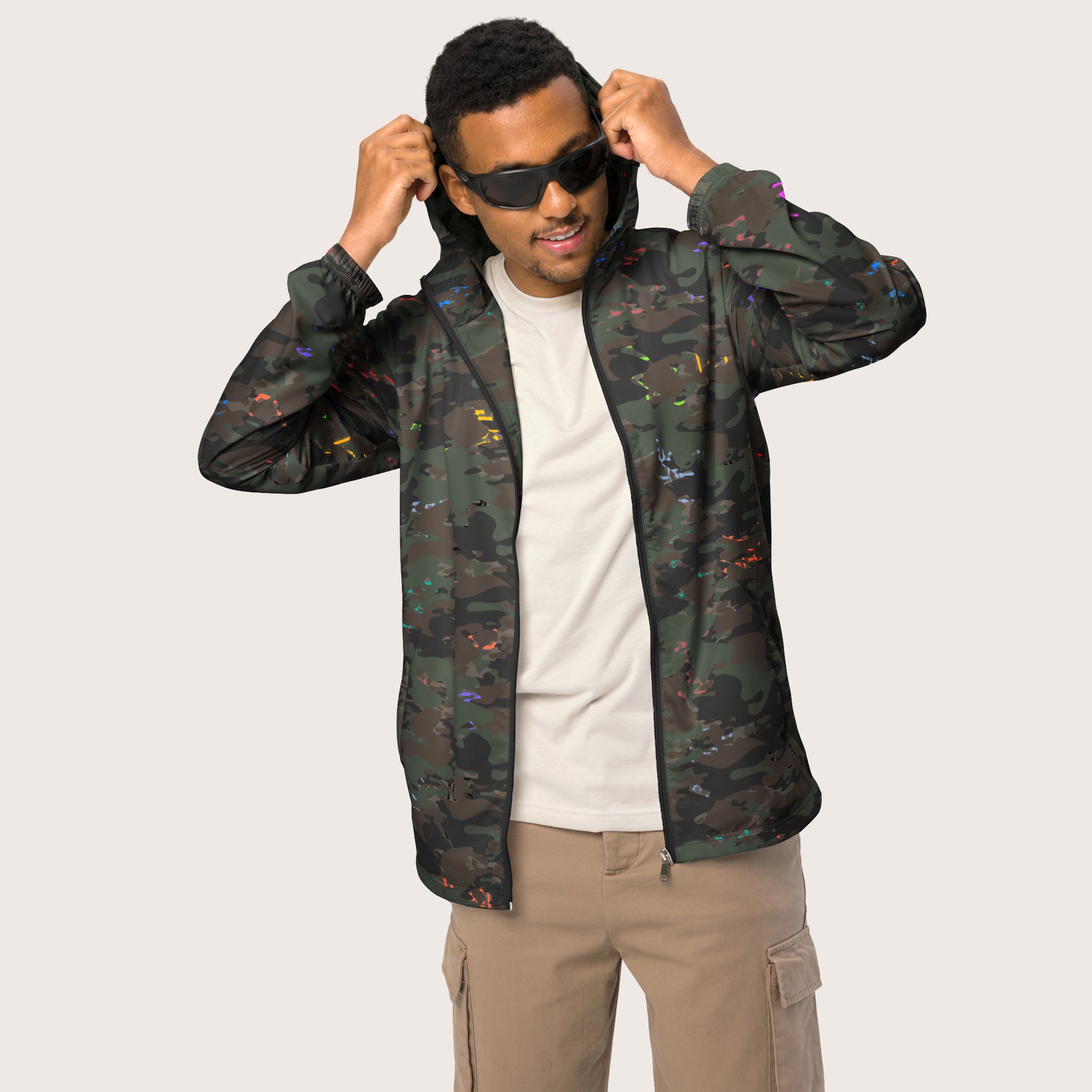 USA CREATES Camo Bit Color Breaker Windbreaker, shown in studio editorial portrait with subtle color-accent camo