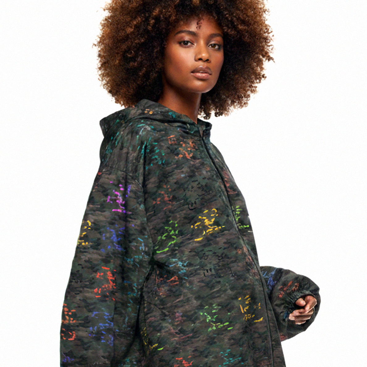 USA CREATES Camo Color Breaker Windbreaker, shown in fashion editorial styling on a woman with color camo pattern