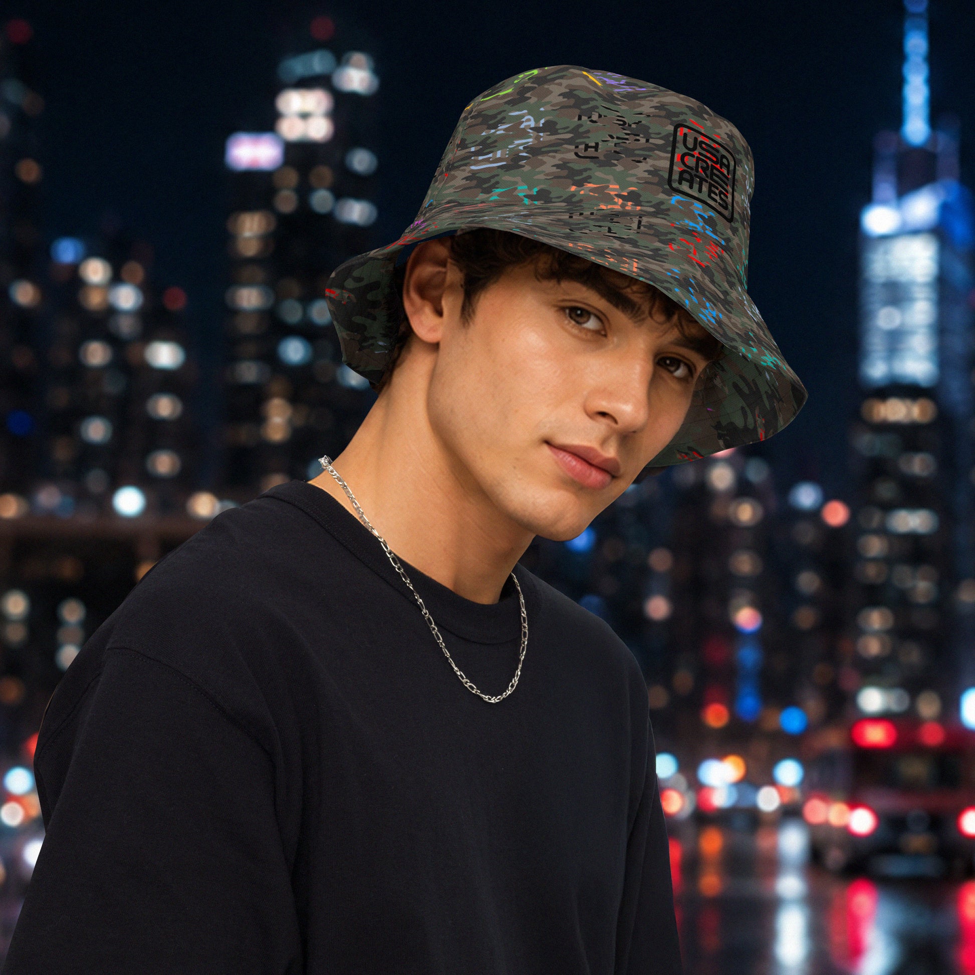 USA CREATES Camo Reversible Bucket Hat, shown in second night editorial styling with Camo Bit Color pattern side