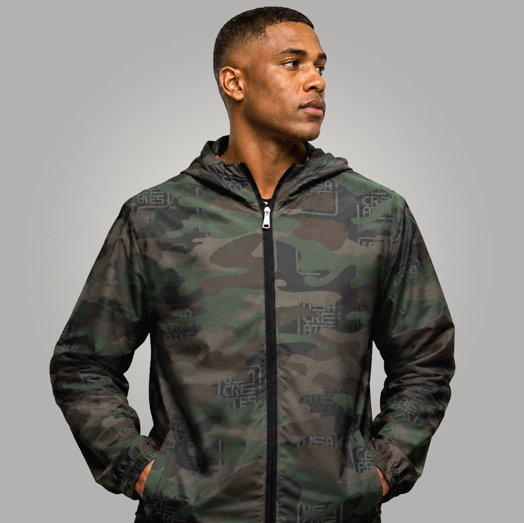 USA CREATES Camo Signature Breaker Windbreaker, shown in studio editorial portrait with tonal camo and fused USA CREATES pattern