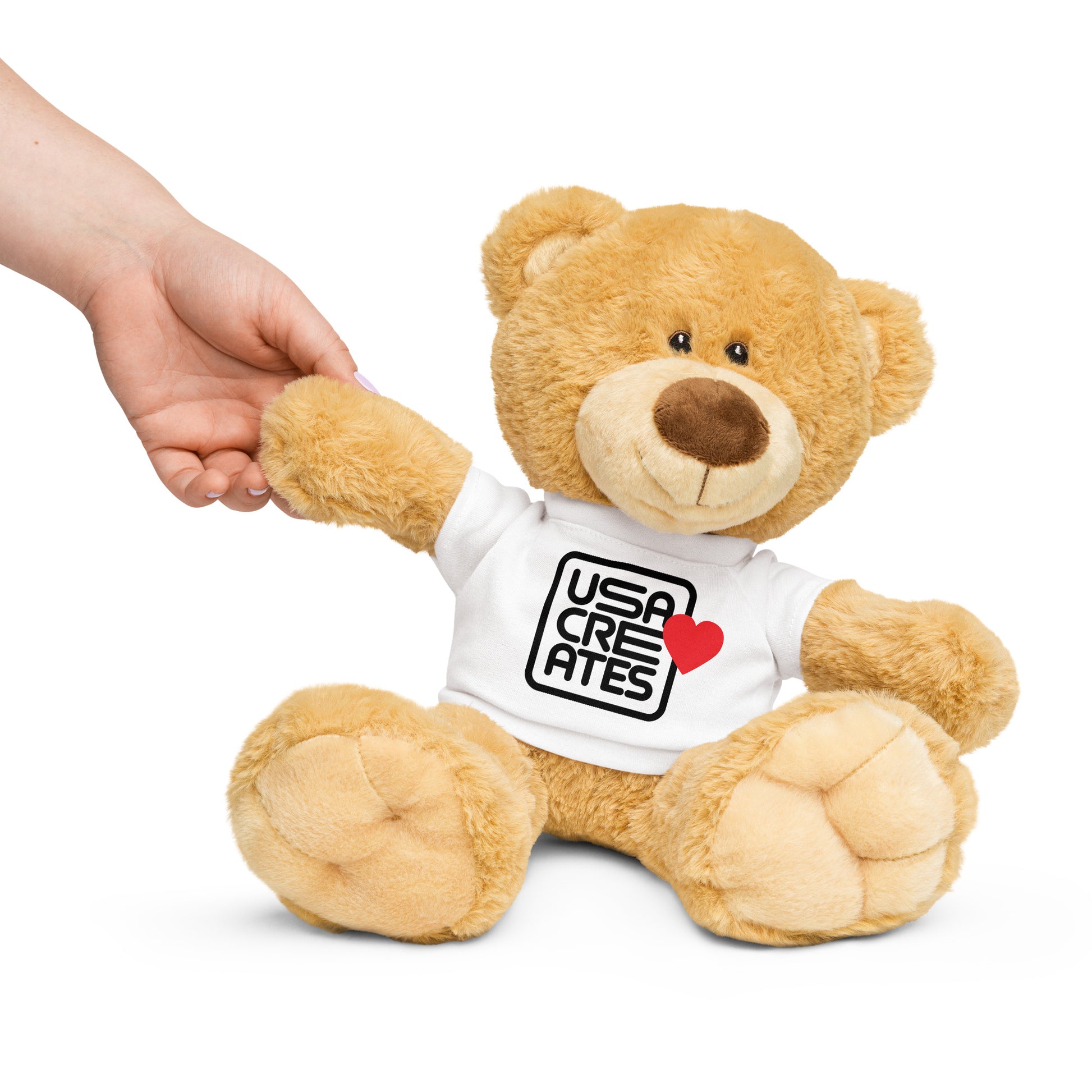USA CREATES Love Bear, angled view of plush bear wearing USA CREATES heart tee