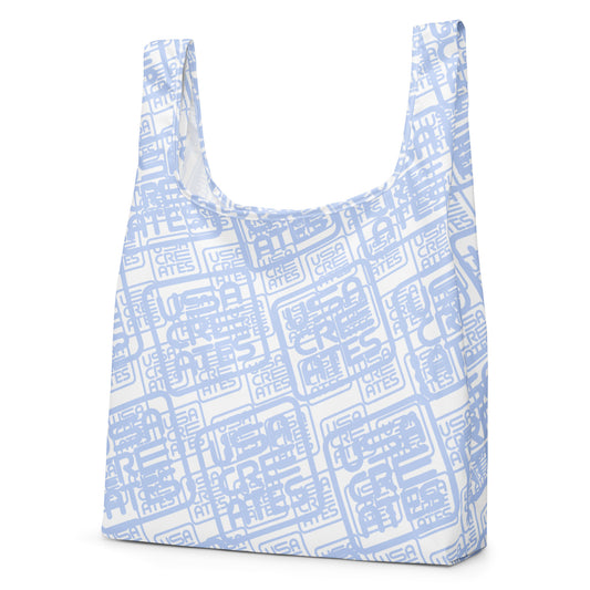 USA CREATES Signature Carry Bag, white left front view with cool gray USA CREATES logo geometric pattern