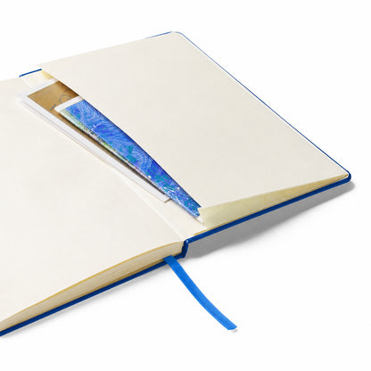 USA CREATES Signature Notebook, blue edition open flat showing cream ruled interior pages with blue ribbon bookmark