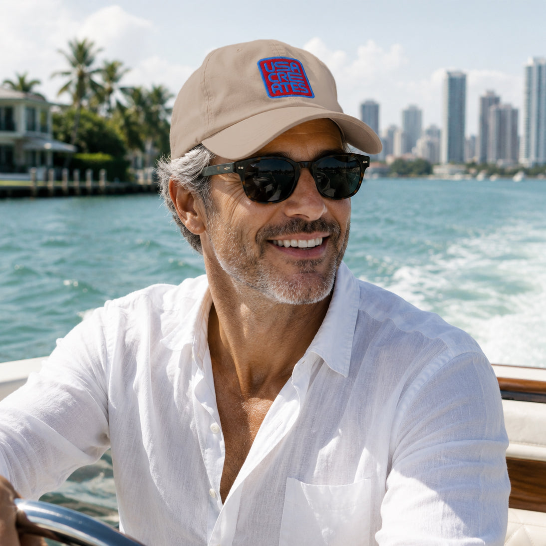 USA CREATES Signature Red Base Cap, shown in Miami Intracoastal boating portrait