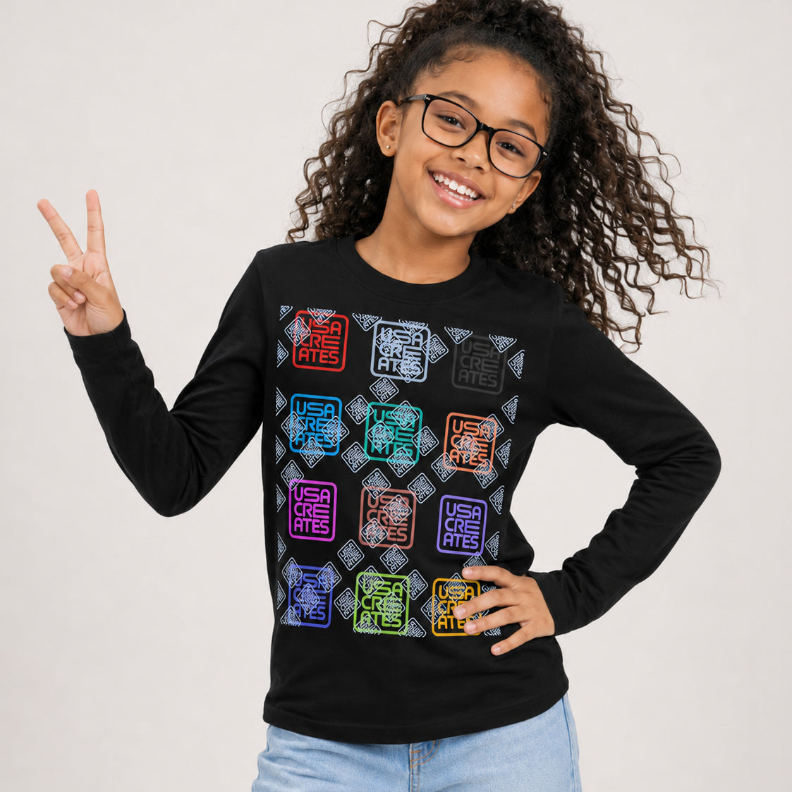 USA CREATES Signature Youth Long Sleeve, youth with peace sign in editorial portrait